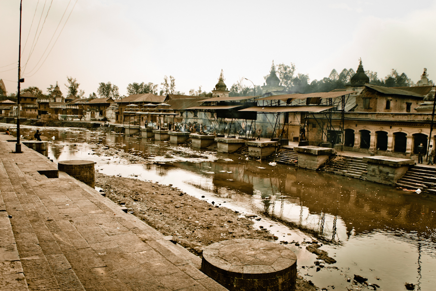 Rows of open-air cremation platforms near Pashupatinath temple.jpg