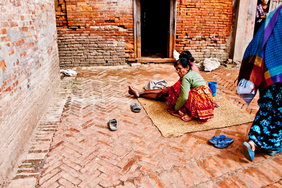 two women sitting outside their house in Bhaktapur, Nepal.jpg