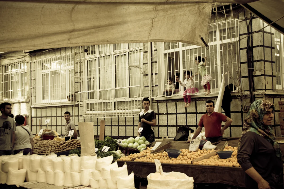 children playing behind barred windows.jpg