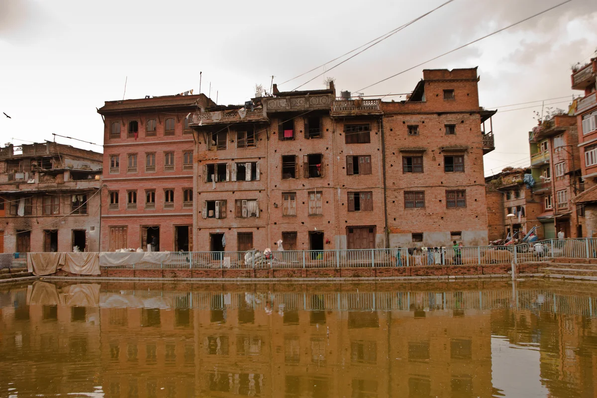 downtrodden bhaktapur windows with lakeview.jpg