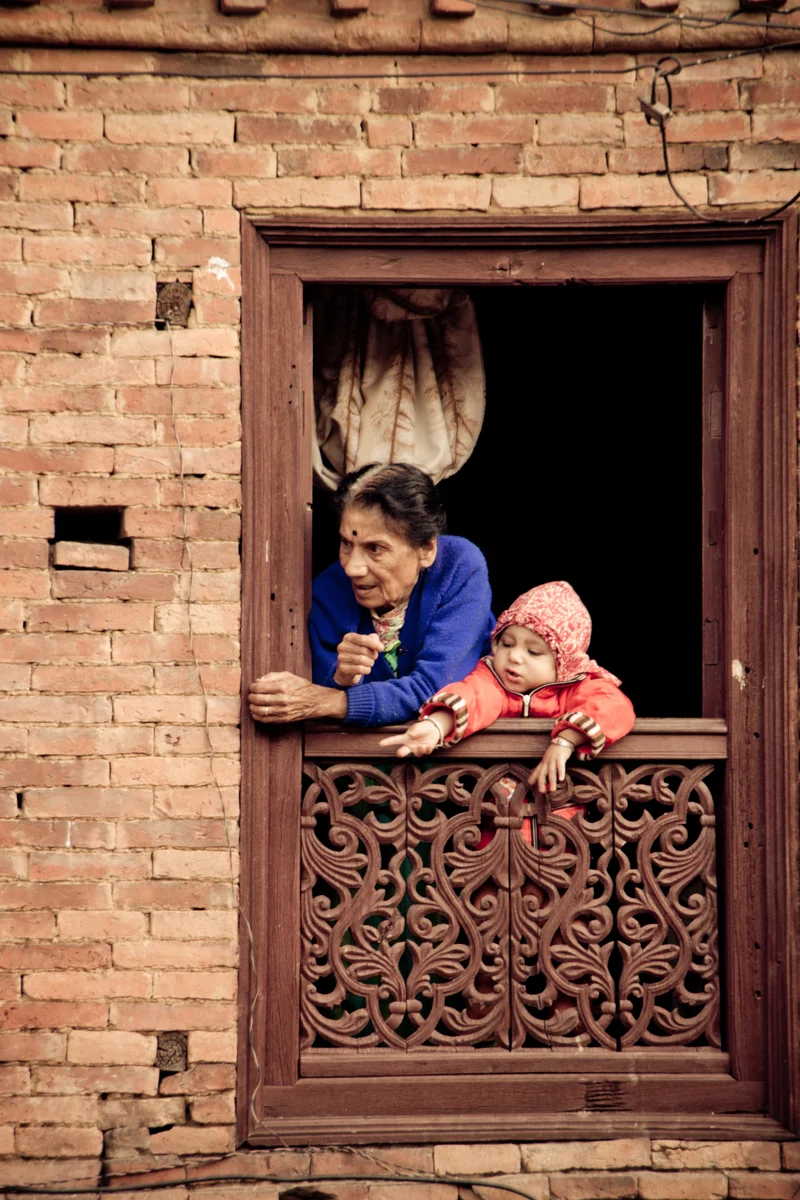 old woman with grandchild at window.jpg