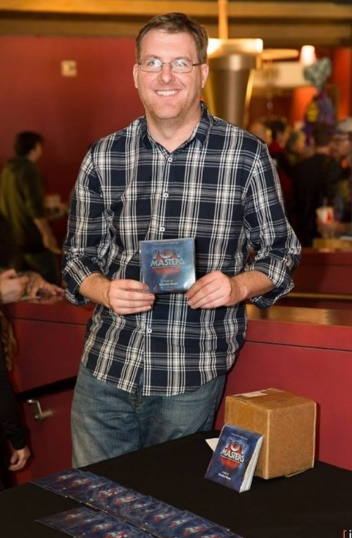 Brandon Moore with the Toy Masters Promo Soundtrack CDs at the the Toy Masters Booth