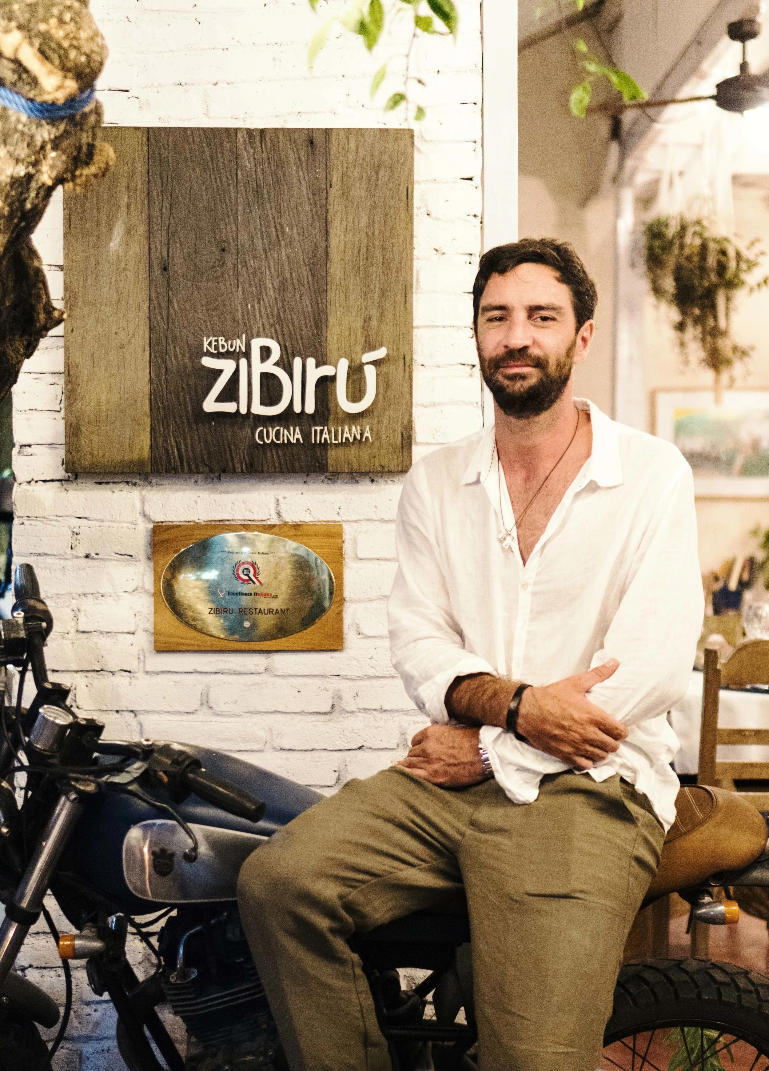 Aside from being a very talented executive chef, Luigi loves to travel and is a motorcycle enthusiast. Here is a photo of Luigi and his custom made bike with leather seats.