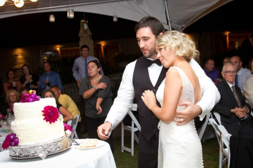 This is one of my favorite candid photos from my own wedding. I think it's because we both look so content...or maybe that look of relief on my face is because my husband didn't smash cake on my face. Either way, you want a sense of calm on your big day :)