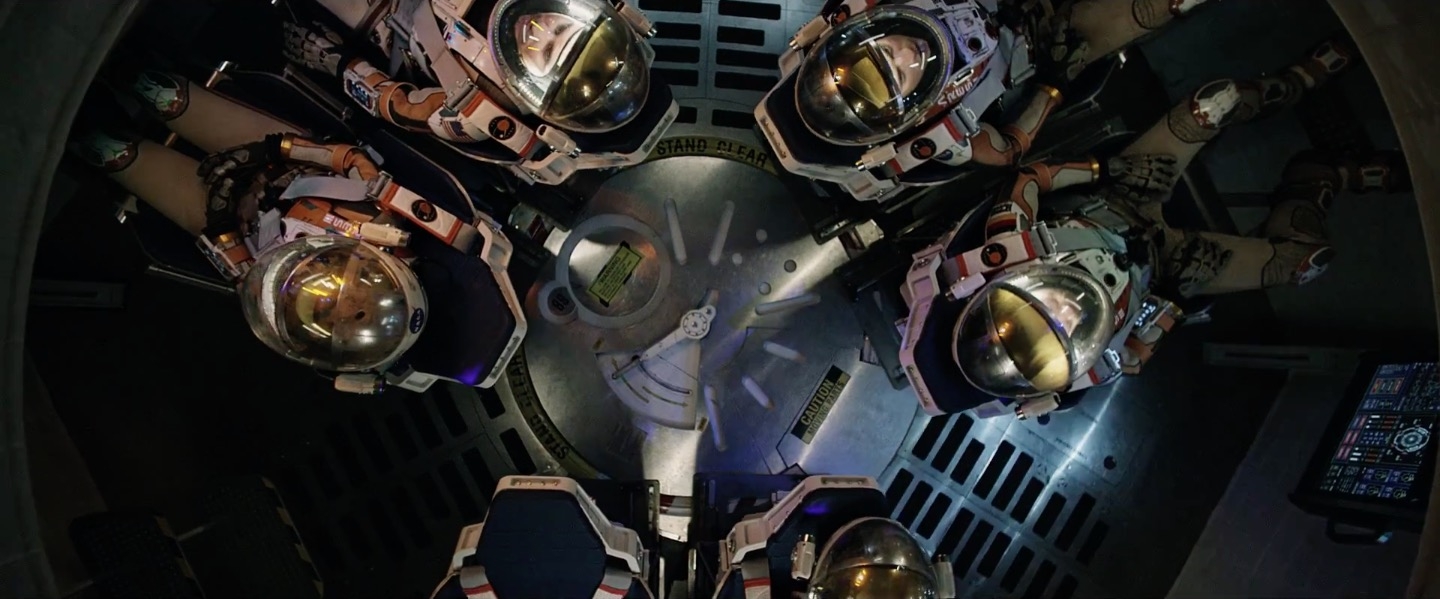 The crew leaving Mars. With one of the astronauts missing. Not a spoiler, since you know that from the trailer. 