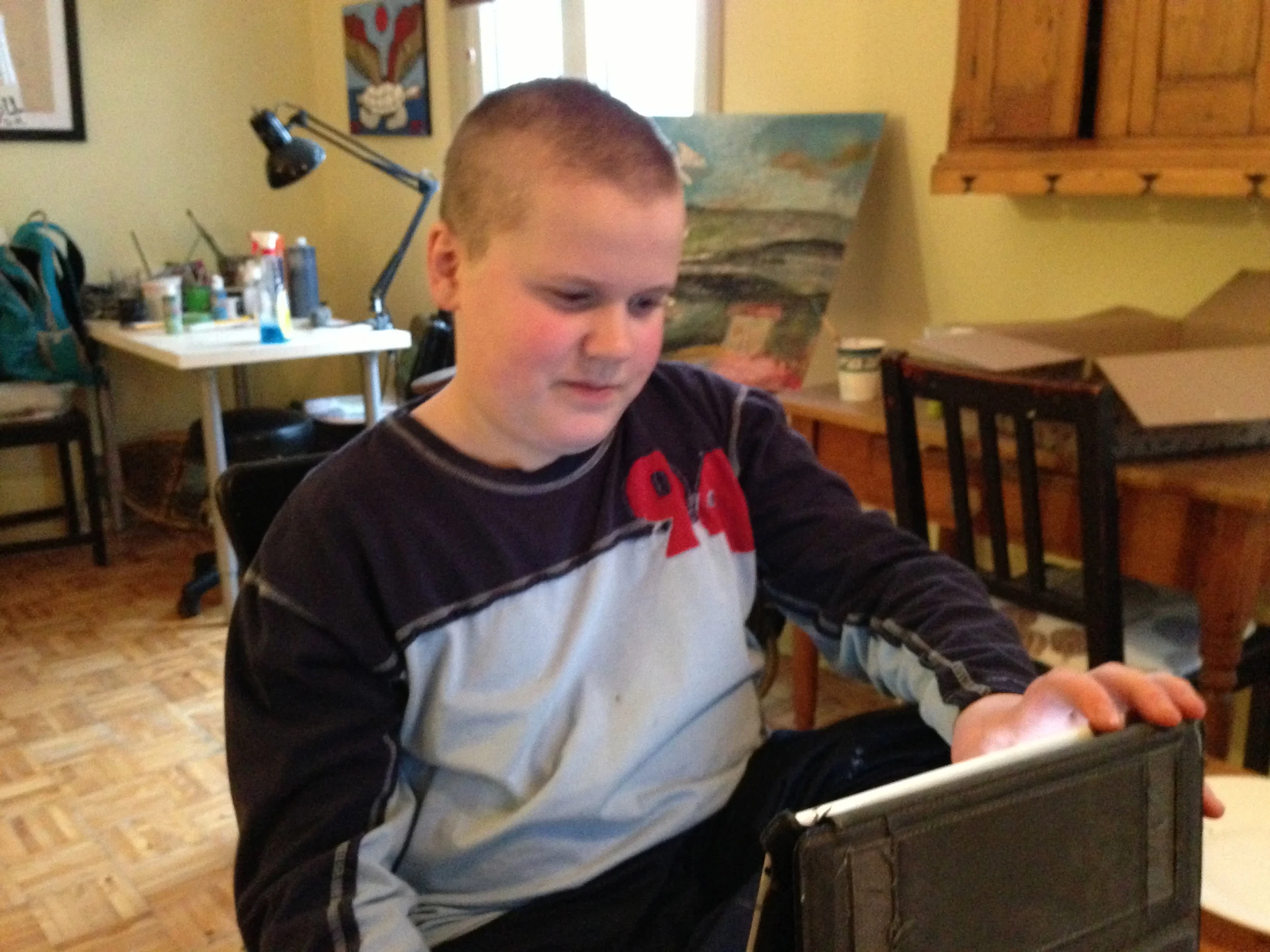 Jon's new MW3 haircut on display while he uses his iPad during this recording