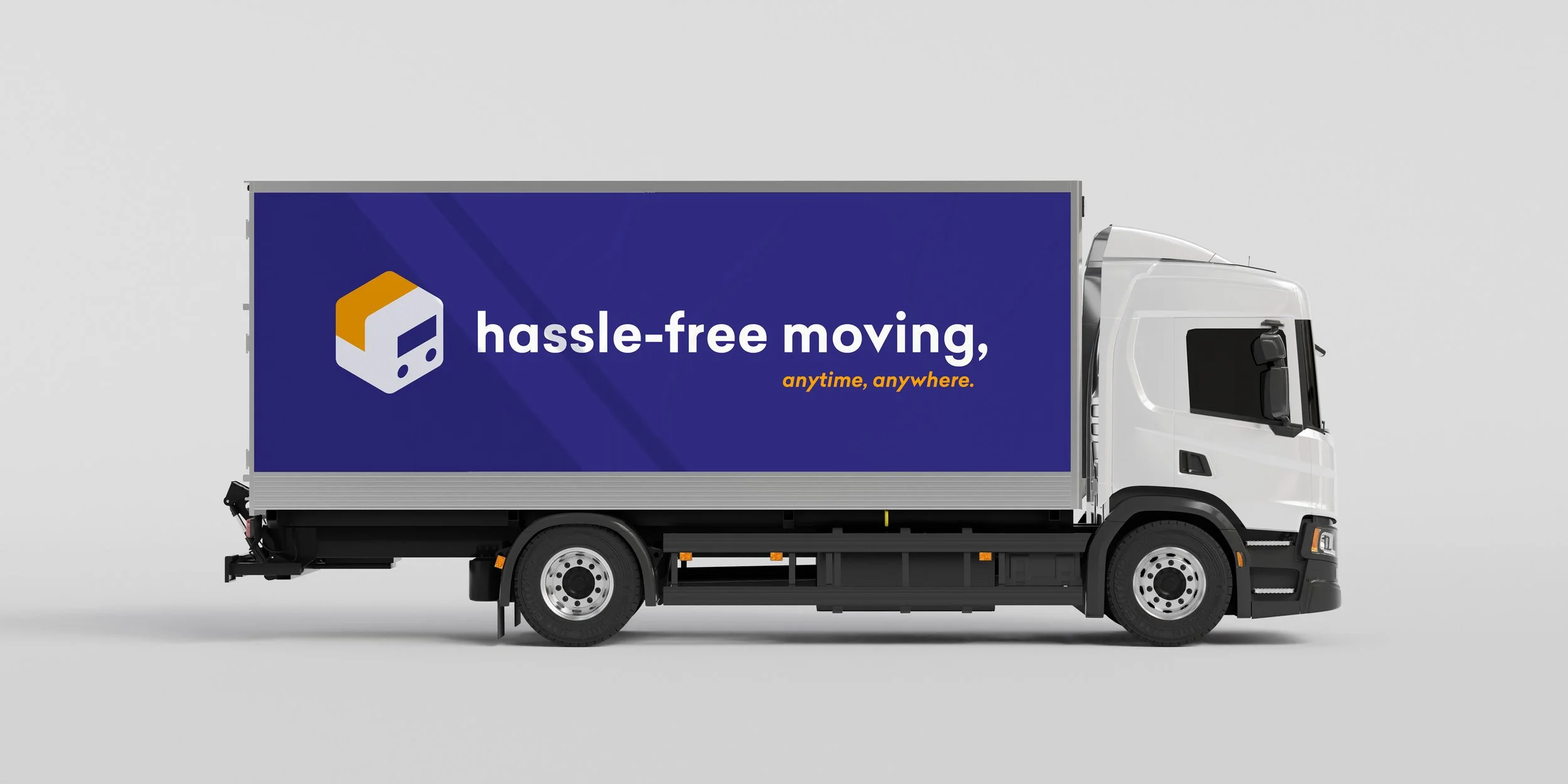 Transinoo branding applied to a moving truck with the tagline “hassle-free moving, anytime, anywhere.”