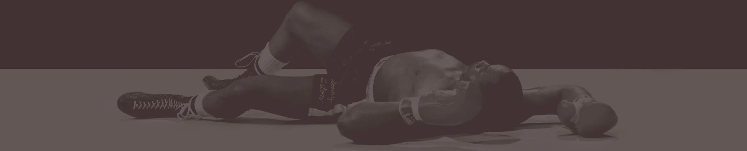 Boxer lying on the canvas after a knockout
