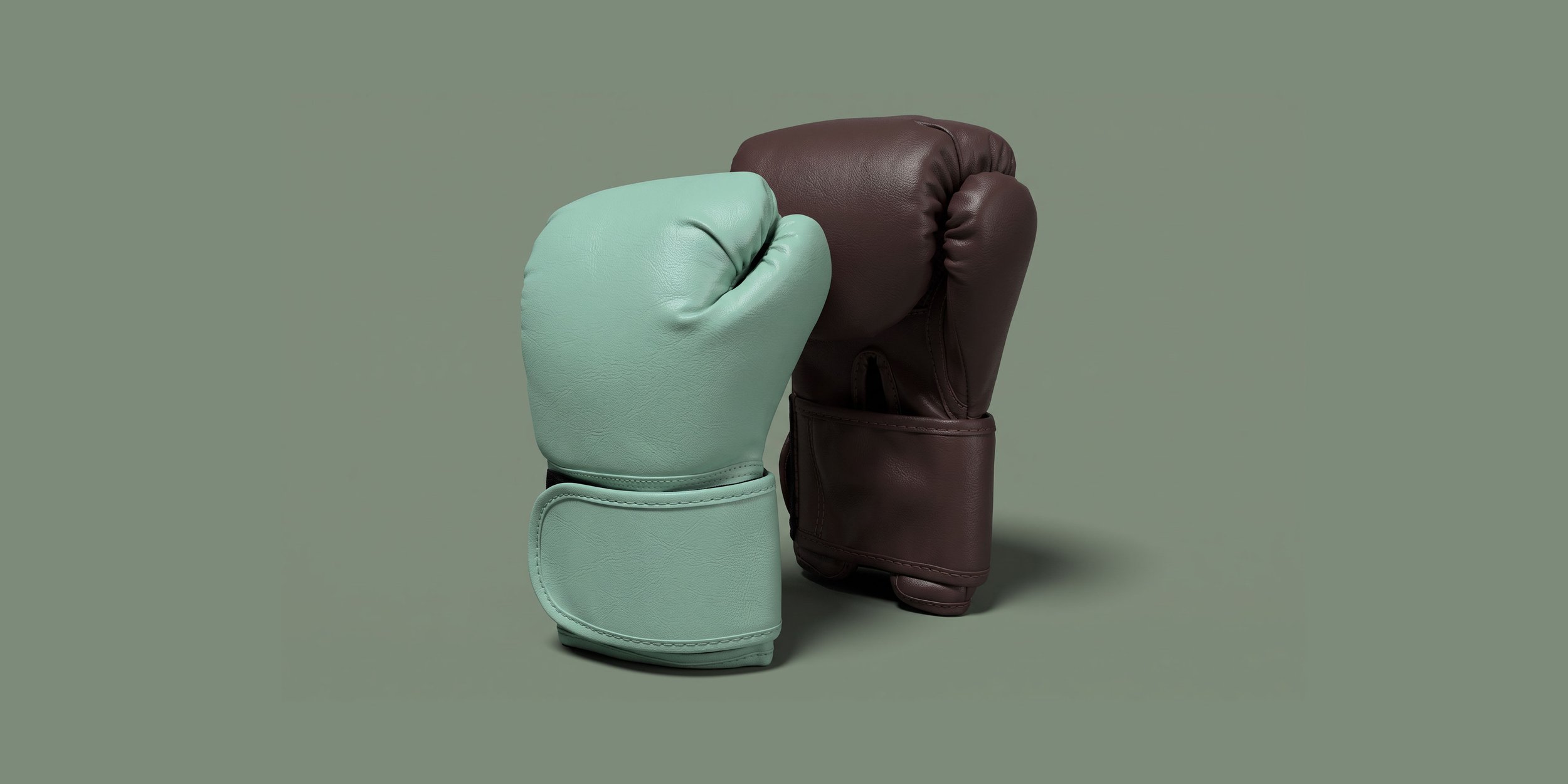 Mint green and dark brown boxing gloves on a muted green background