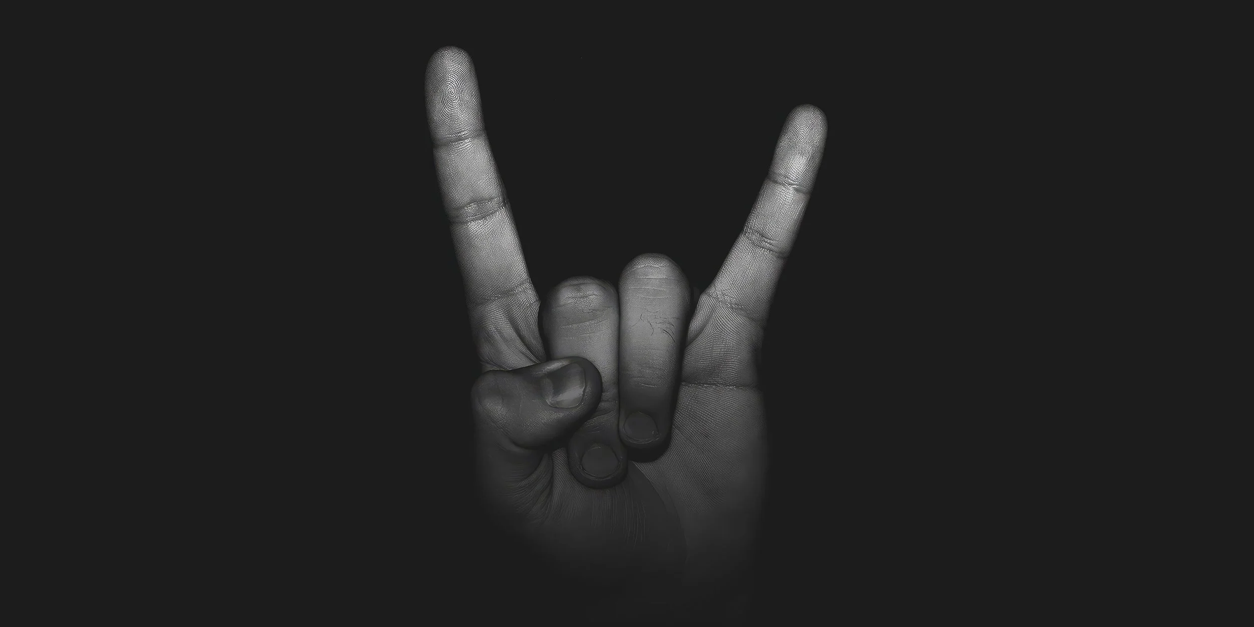 Rock ’n’ roll hand gesture representing the inspiration behind the App’n’roll logo design.