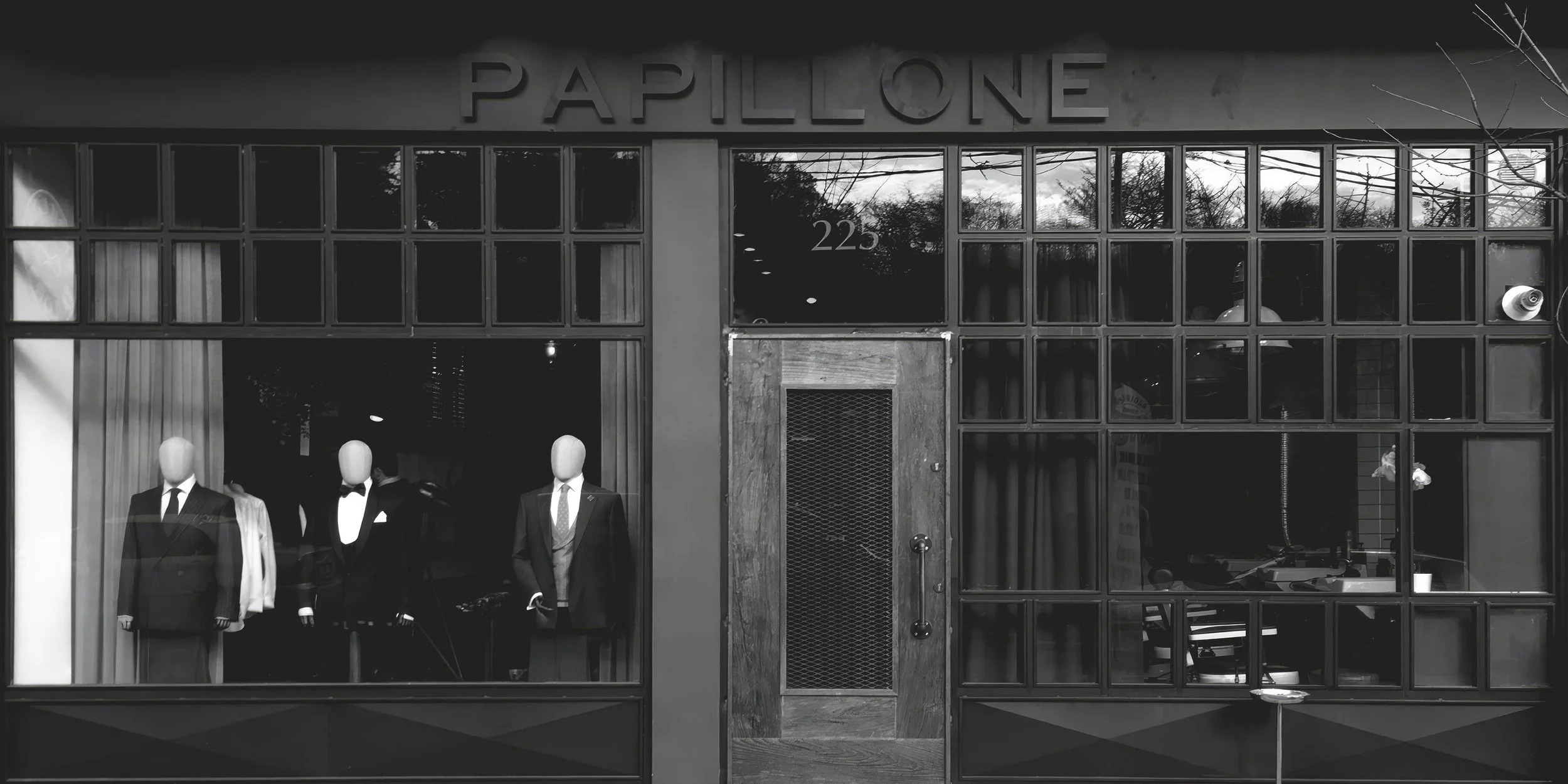 Papillone bespoke tailoring storefront with logo signage