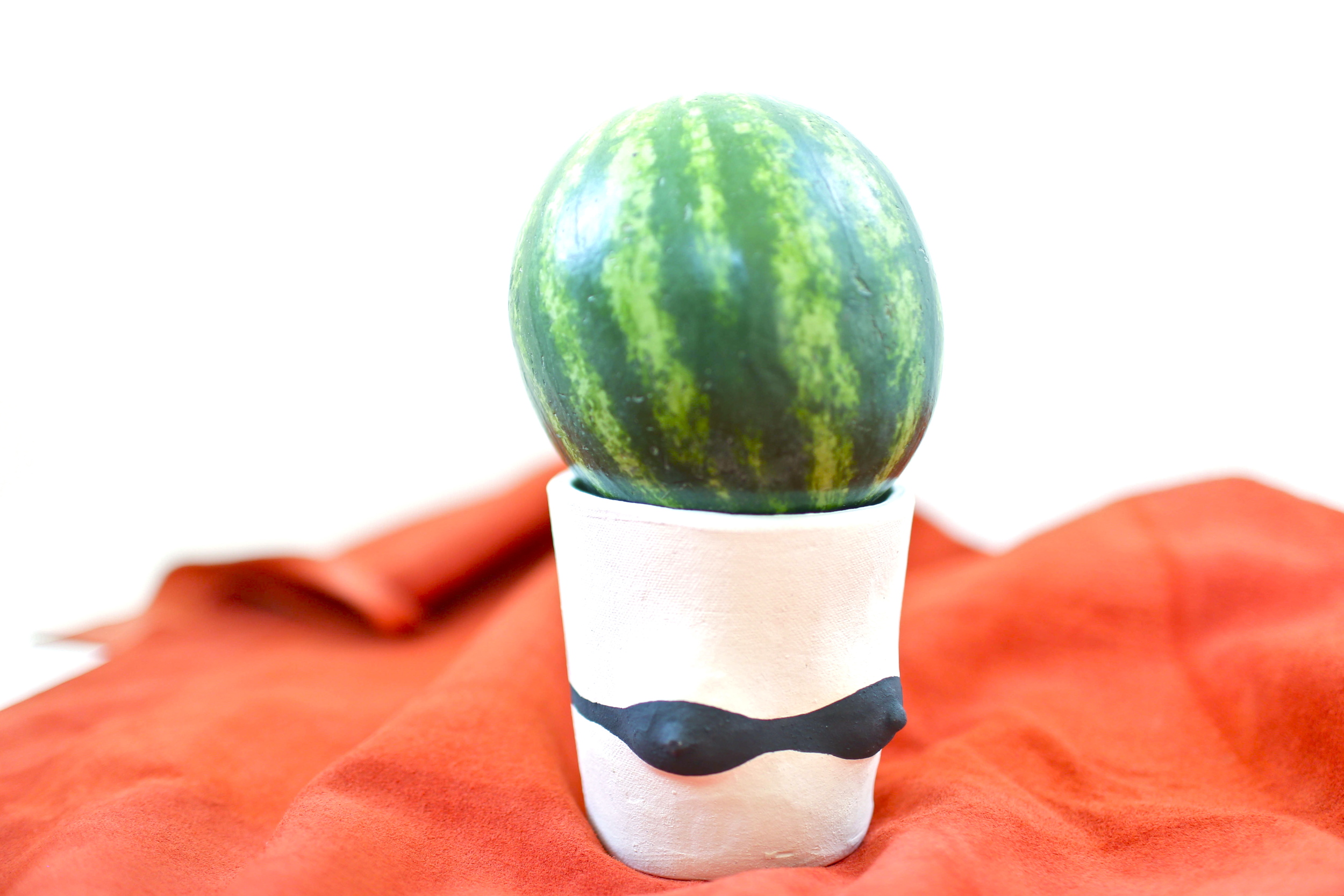 Melon with ceramic by Isaac Nichols .