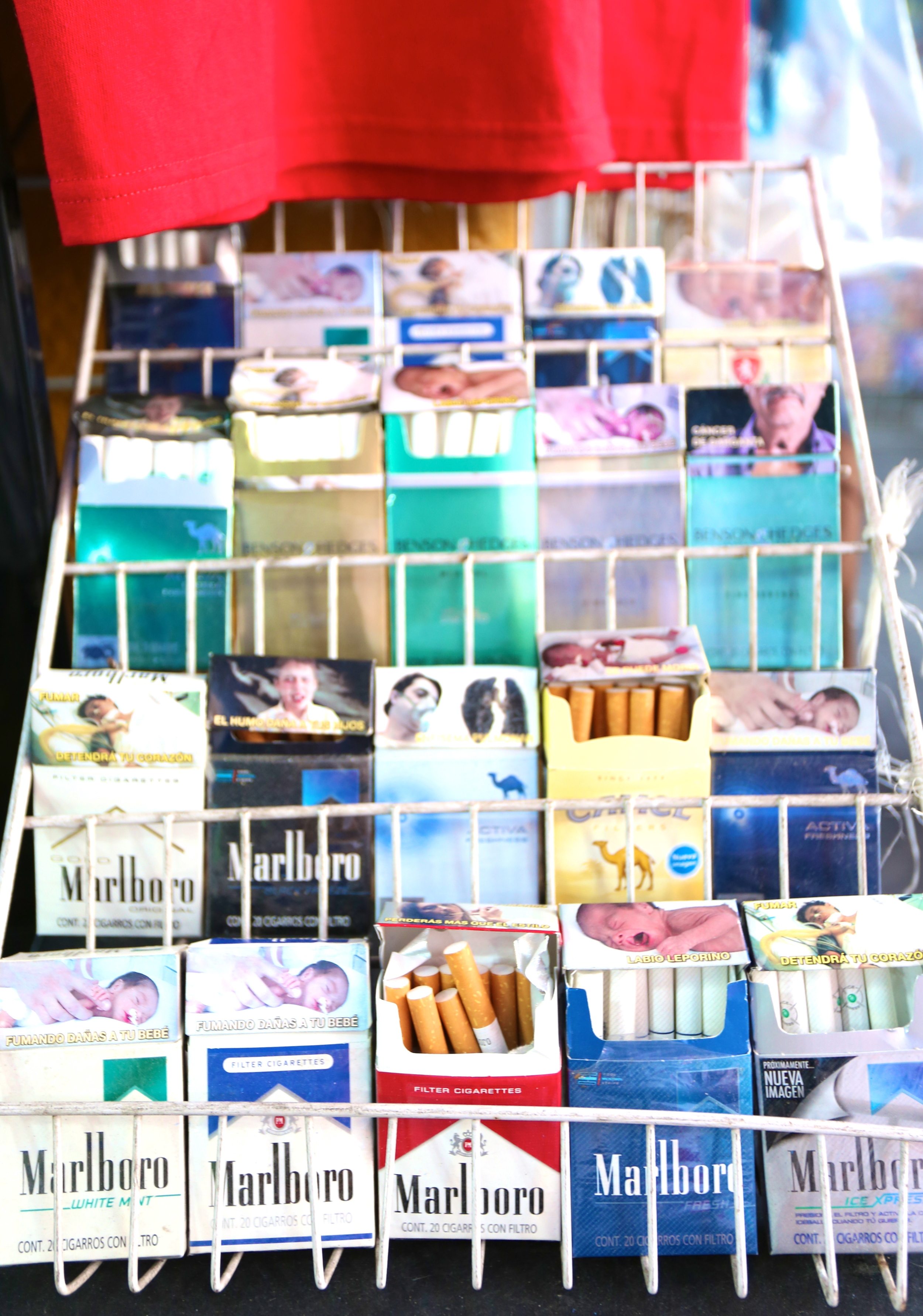 In any convenience stall you can get singles. Watch out though, because lungs and babies both hate these things.