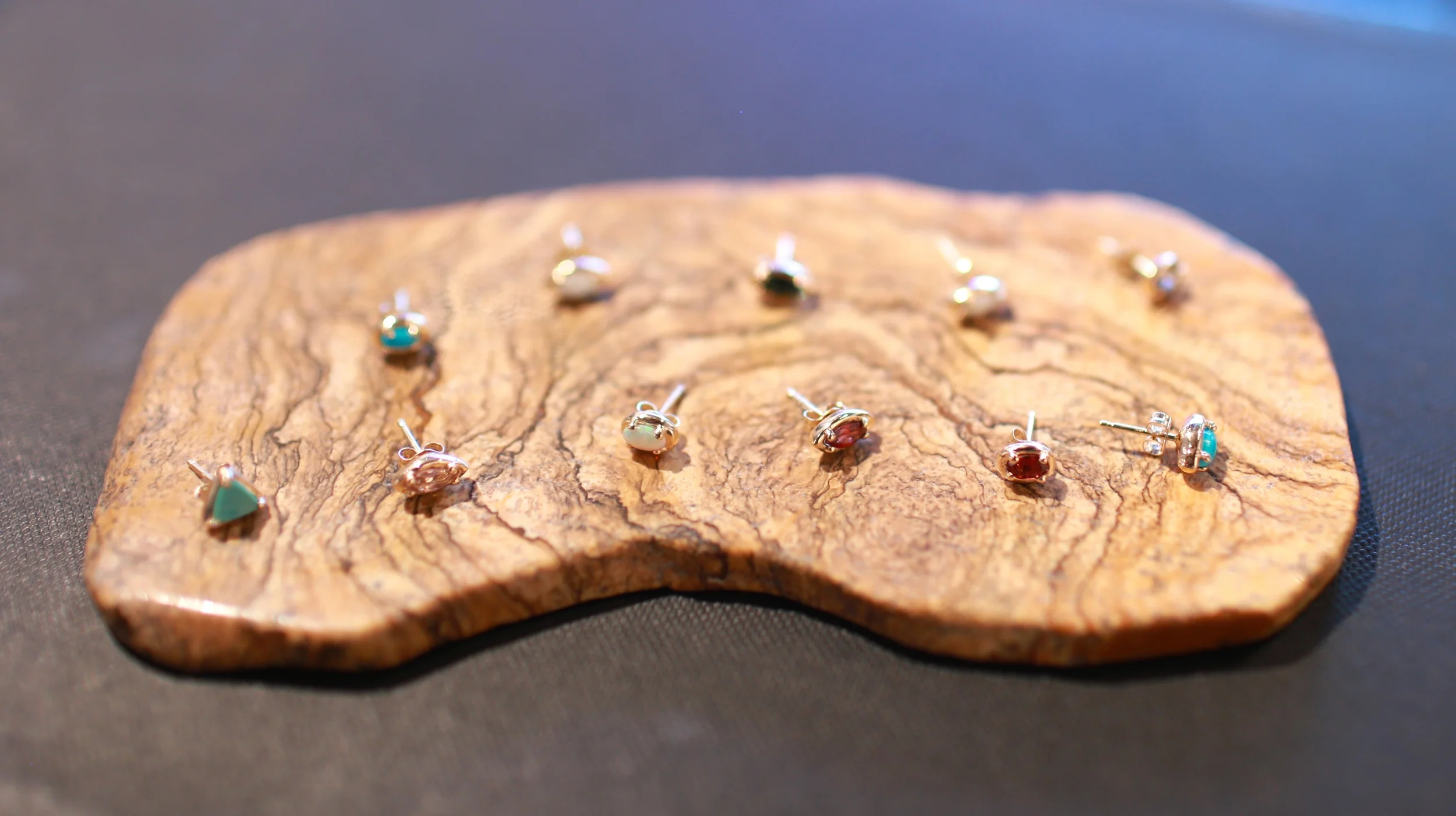 Some of the newest designs of mix-n-match fine ear studs, made with yellow and rose 14k gold and precious stones.