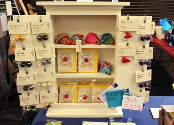 A whole cabinet filled with cat toys.