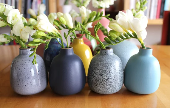 I added some more bud vases to my collection. At the Sausalito store there are often samples with special glazes that never reach the rest of the product line. It's one of the reasons I started collecting the vases. The vase on the left is an example of a special glaze.