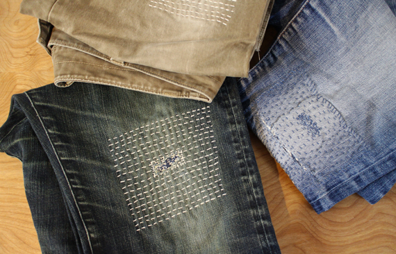 Samples of Katrina's visible mending using the Sashiko stitch.