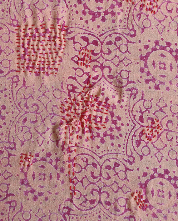 My first mendings on the piece are in the center and upper left of this image.