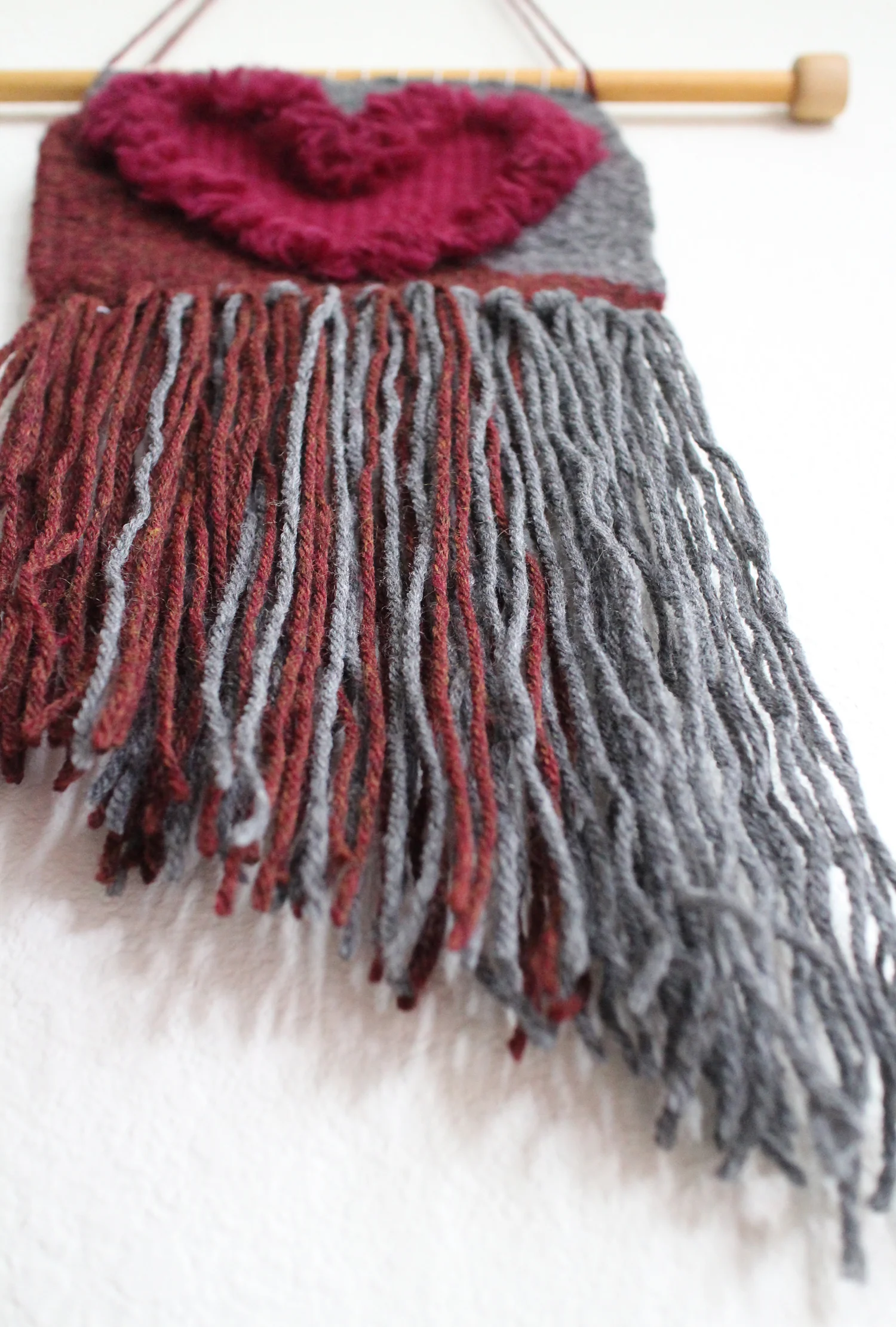 This heart weaving is the first project I've planned out. I wanted to use only yarns I already owned. With a little help from a friend I decided to make it a fuzzy heart using wool roving.
