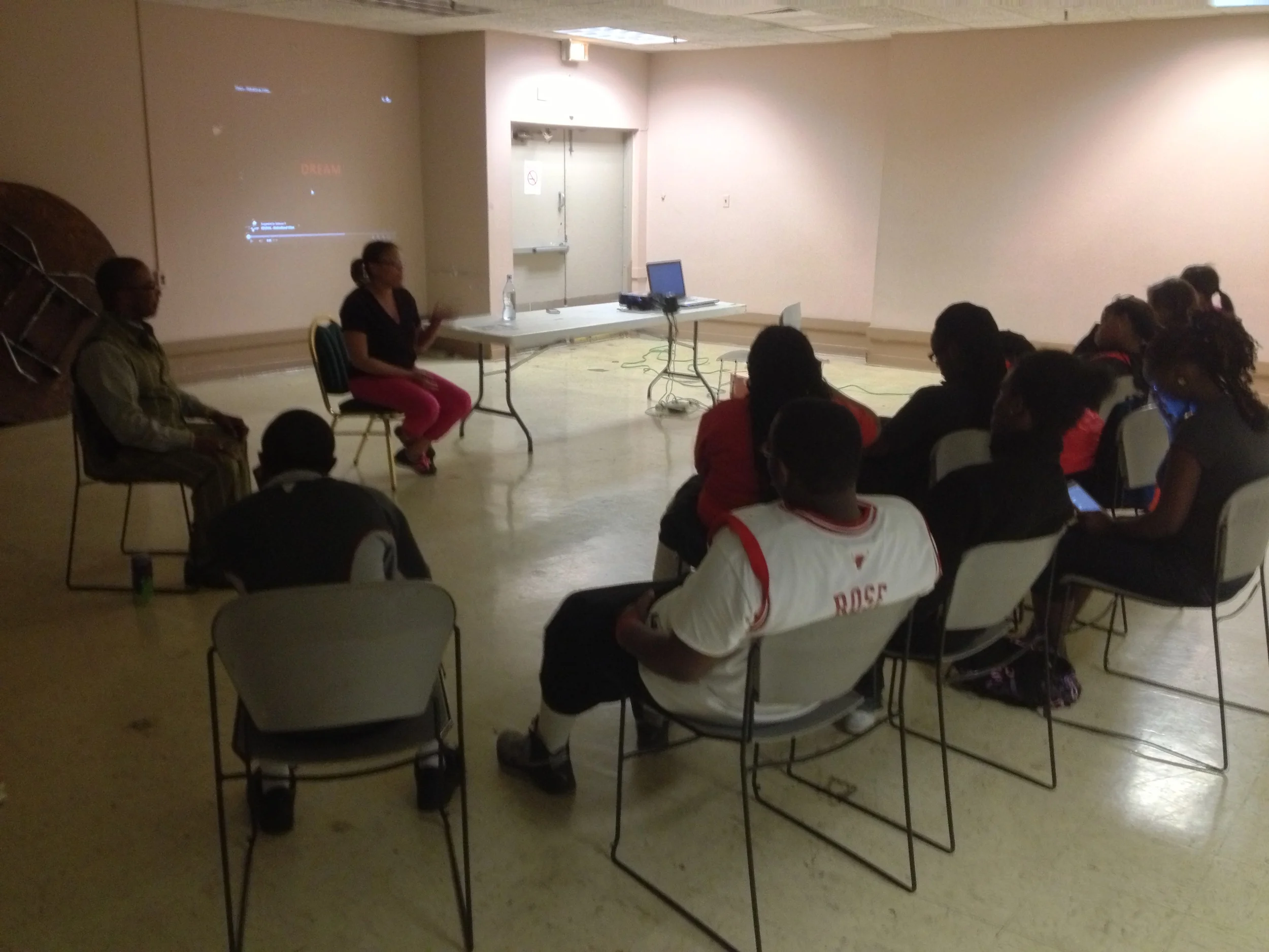 Walter and an associate leading a discussion on teen pregnancy.