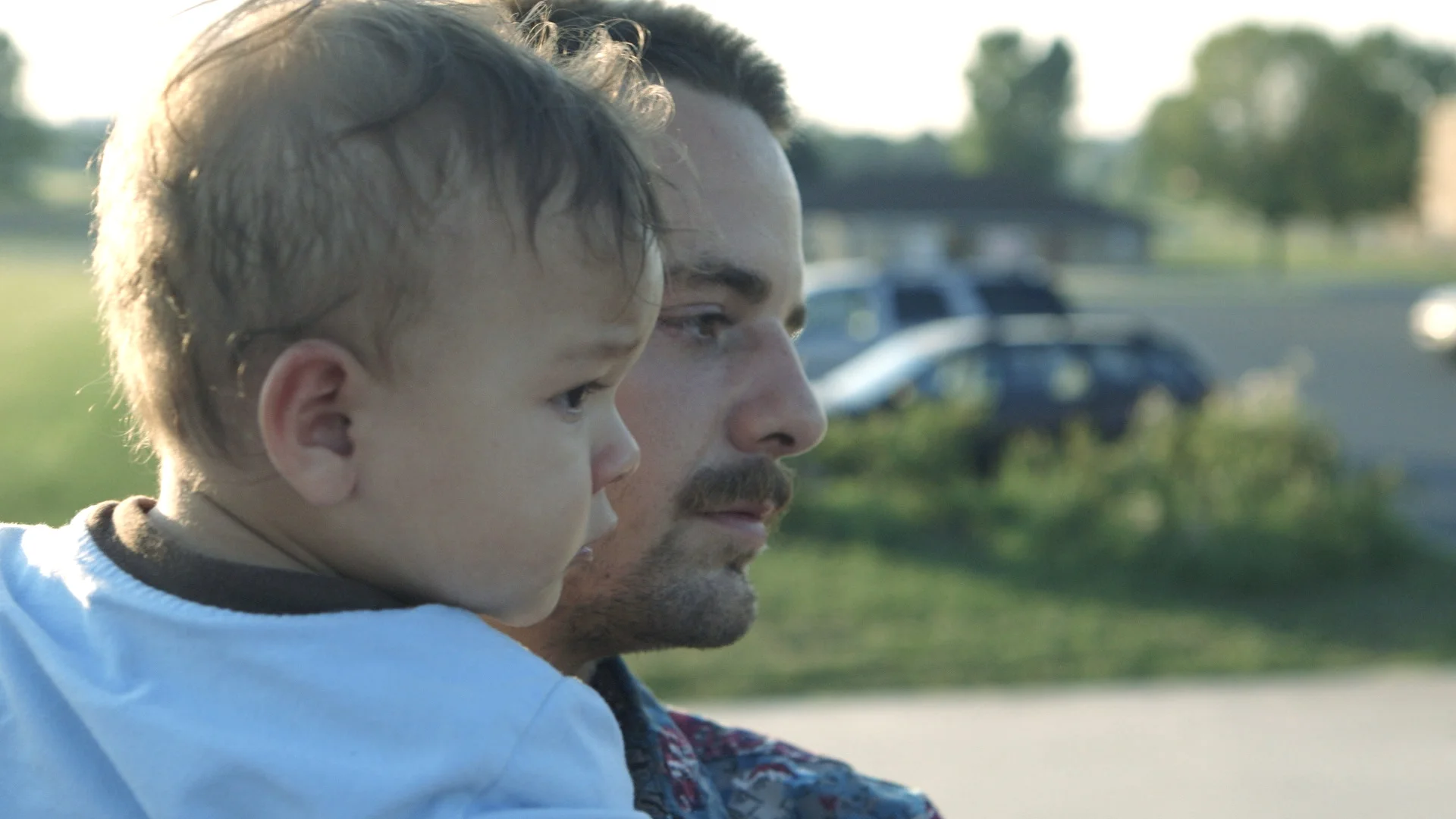Zack--holding elliot at skatepark (2).jpg
