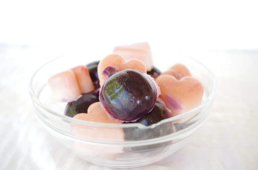 For these smooth-textured yummy gummies, I melted the gelatin/water mixture in a double boiler until smooth, let cool ever so slightly (it never gets too hot to begin with) and then added my amino blends, The pink ones have 4 packets unflavored gelatin + 4 scoops Strawberry Kiwi Aminolast Recovery + Endurance Fuel by Gaspari Nutrition + one packet of a strawberry flavored vitamin drink mix. The purple ones have 18 scoops of the aforementioned grape mix - to make a serving size of gummies more reasonable - plus 4 packets unflavored gelatin and one packet cherry vitamin drink mix. You know, just for fun.