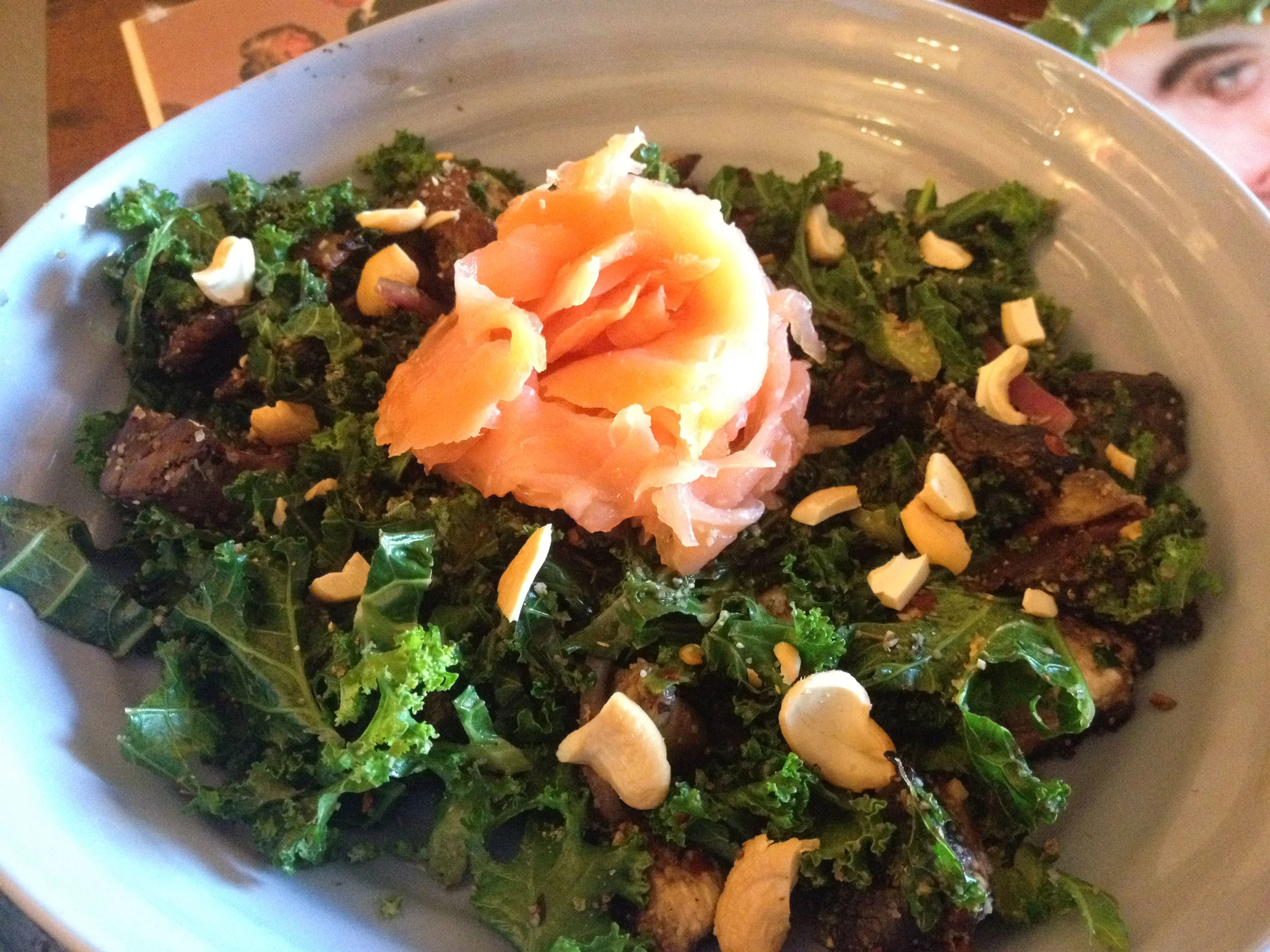 This Coconout Oil Sauteed Garlicky Kale with Smoked Salmon and Cashews was super quick to make, but also seemed totally gourmet! Spritz with fresh lemon juice or zest for an extra something!