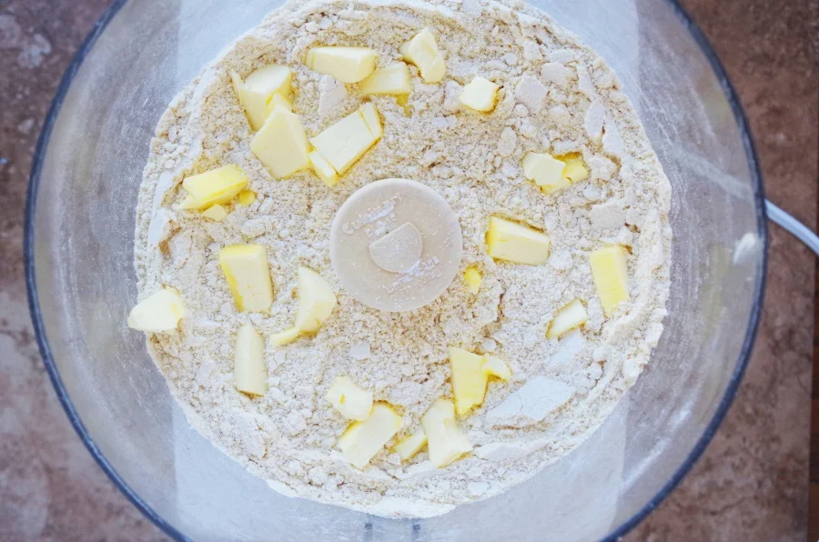 Chop up 2 T. cold butter and add to the dry ingredients. Process to make sure the butter is evenly distributed throughout.