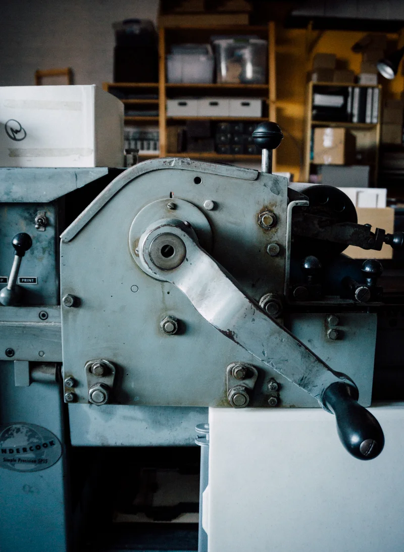 One of several hand operated presses used to print cards and custom jobs.