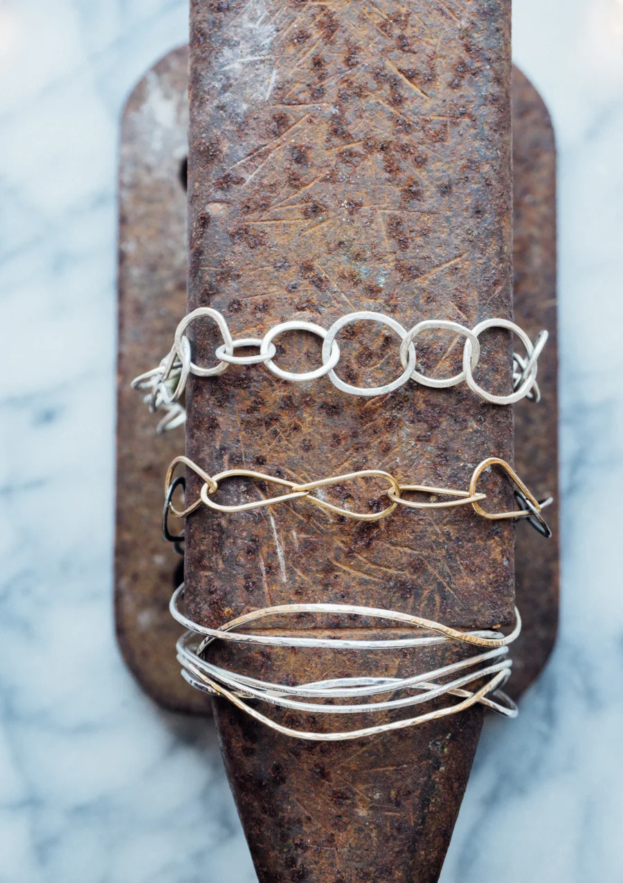 Bracelets and necklaces in sterling silver and 14k gold.