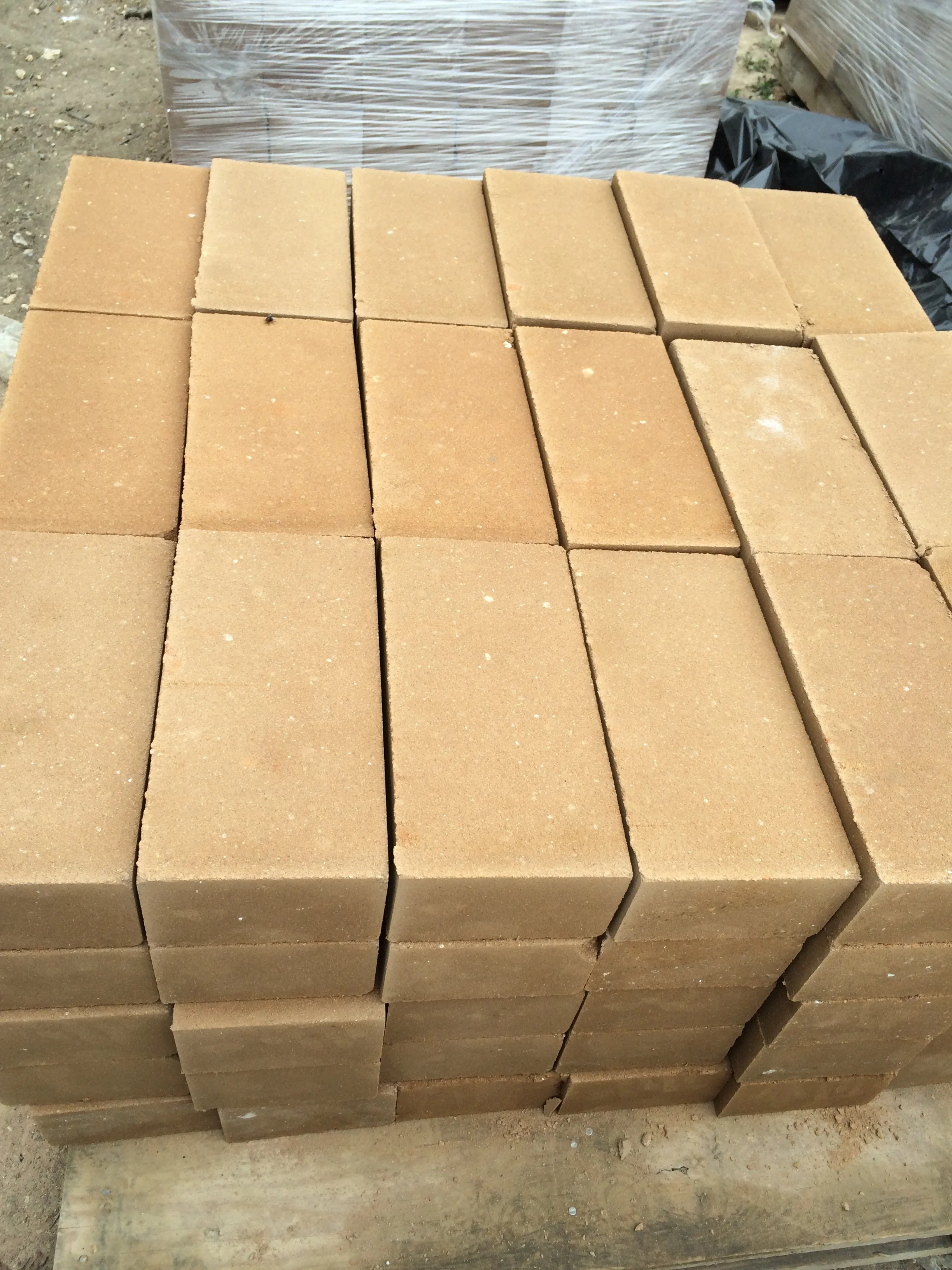 Freshly made blocks are placed on pallets for curing