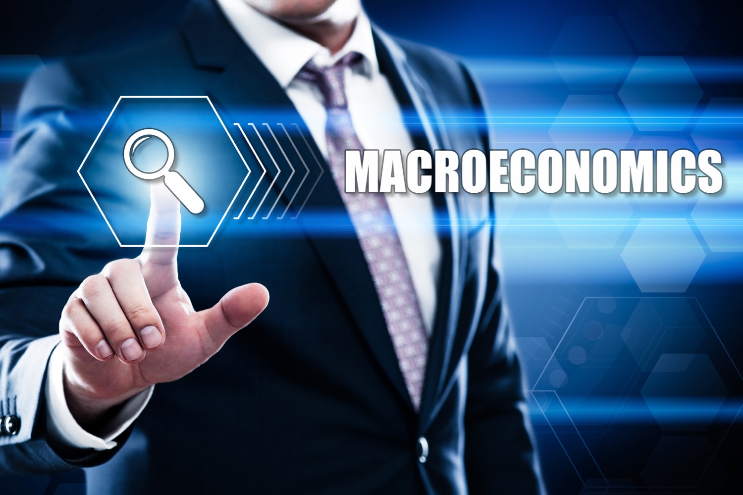 Business, technology, internet concept on hexagons and transparent honeycomb background. Businessman pressing button on touch screen interface and select macroeconomics.jpg