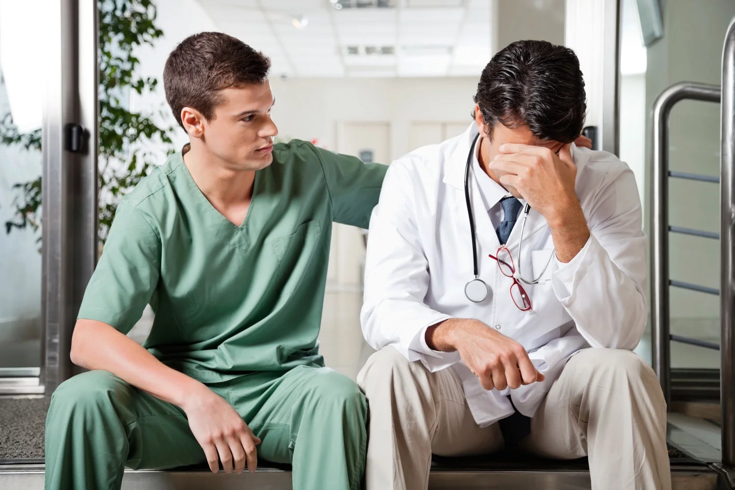 Colleague Comforting Upset Doctor.jpg