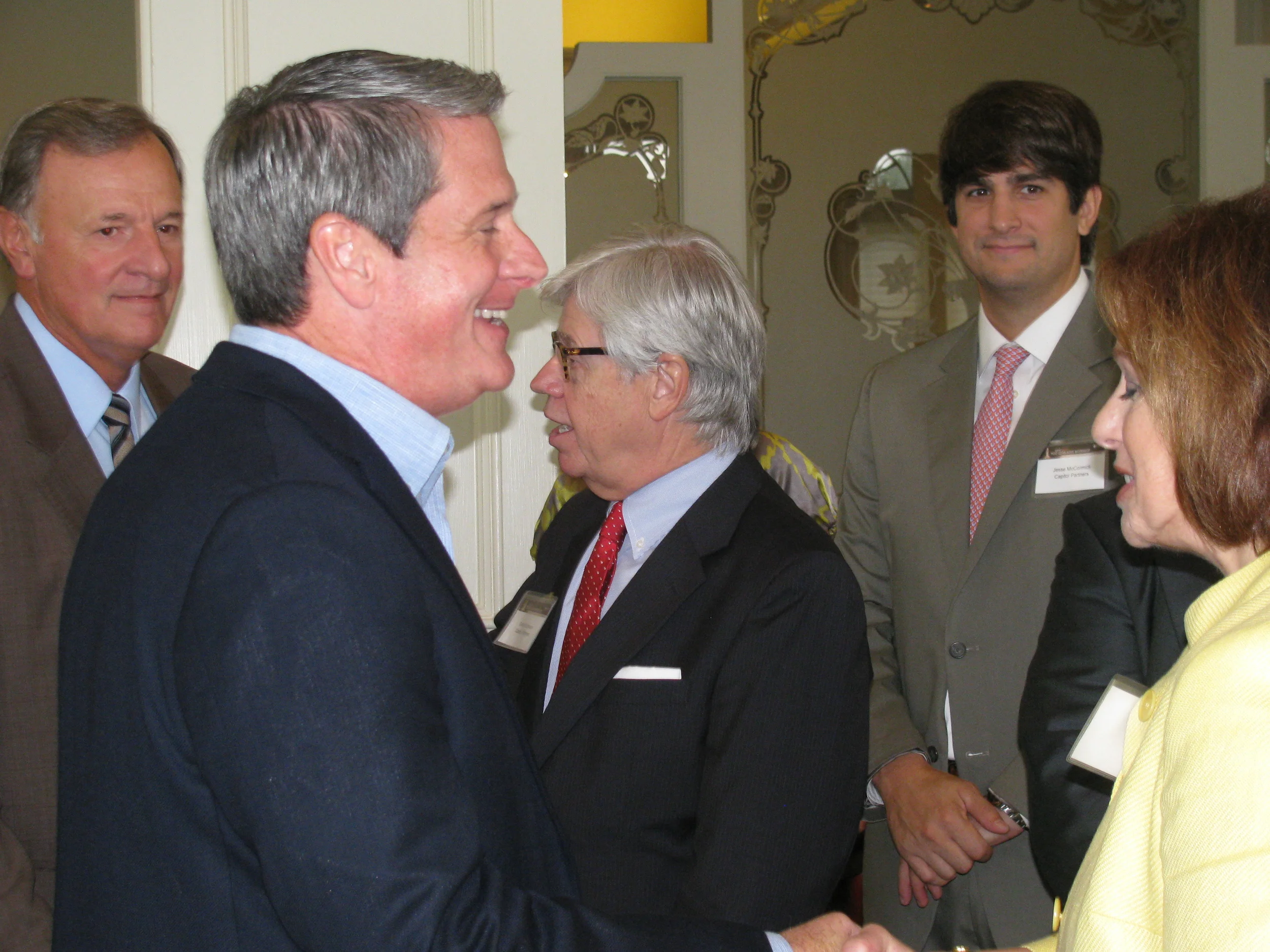  U.S. Senator David Vitter talks with LAHP lobbyist Cheryl McCormick as Sen. Ben Nevers (left), Derrell Cohoon (center), and Jesse McCormick (right) join in. 