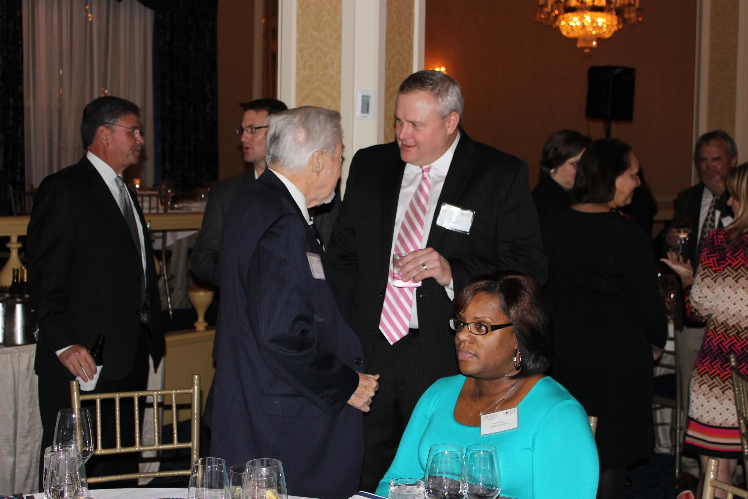 Board of Directors members Doug Layman of Gilsbar (right) chats with Don Hidalgo of Health Associates (left) 