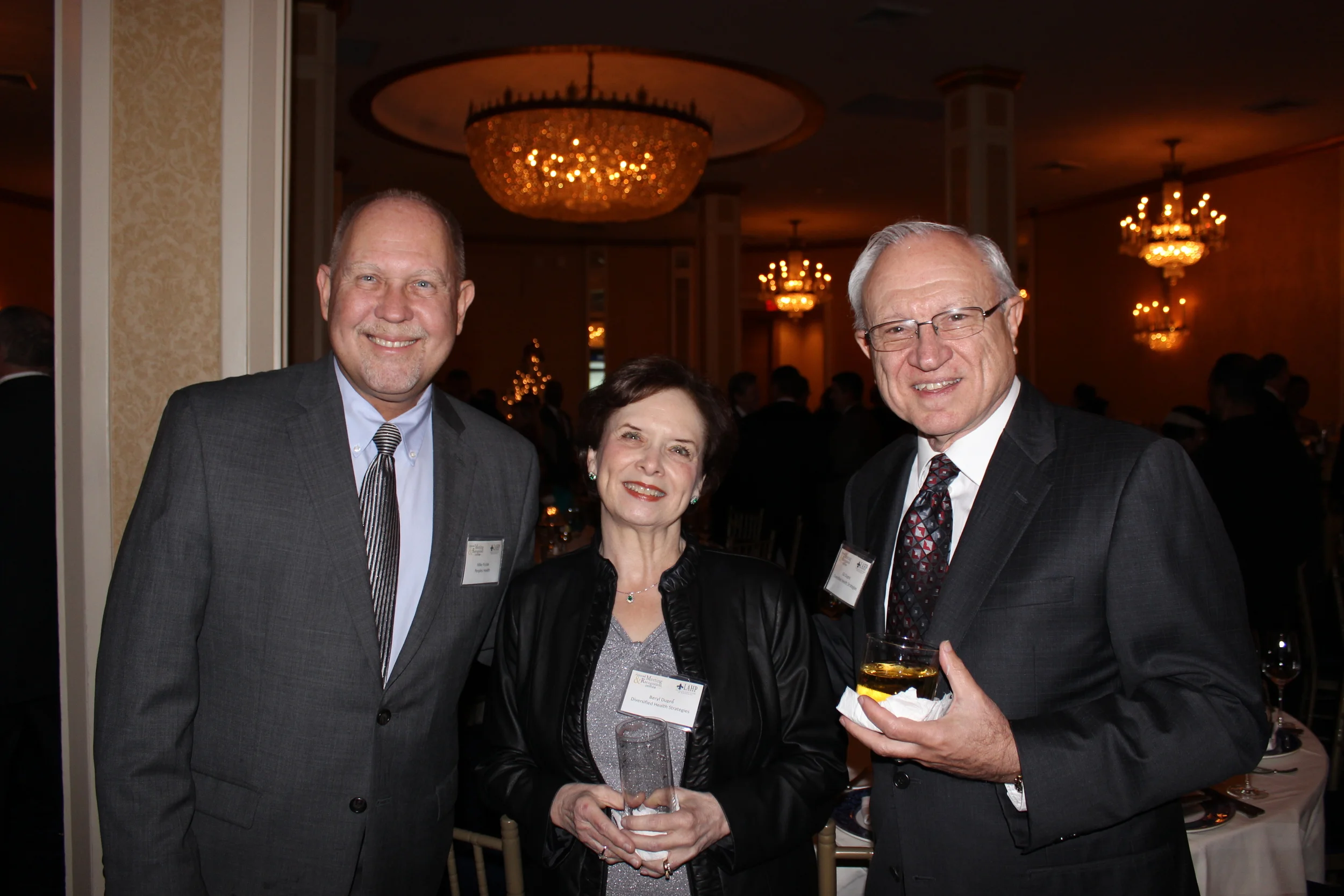  Mike Putiak of Peoples Health (Left), Beryl Dupre' (center) and LAHP founder and former CEO Gil Dupre' (right) 