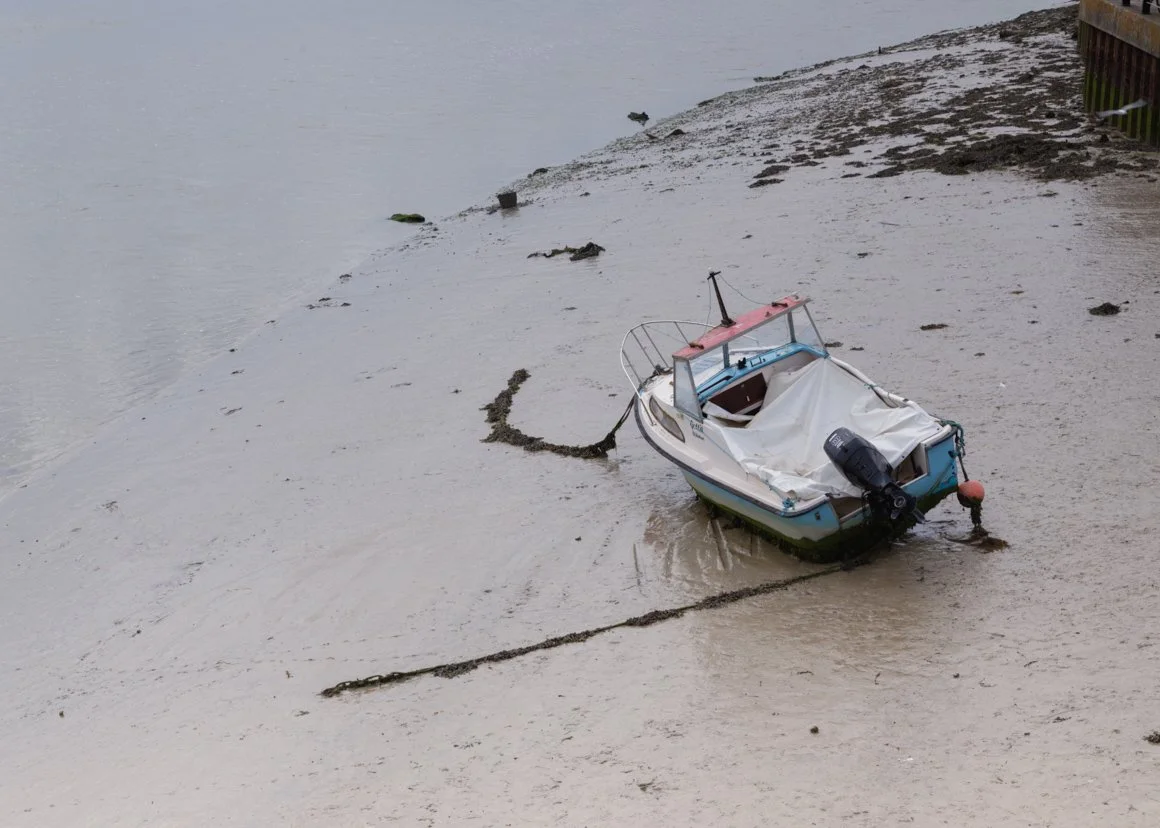 Boat ar River Adur at low tide