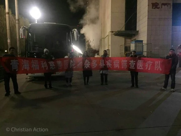 Team with Banner.jpg