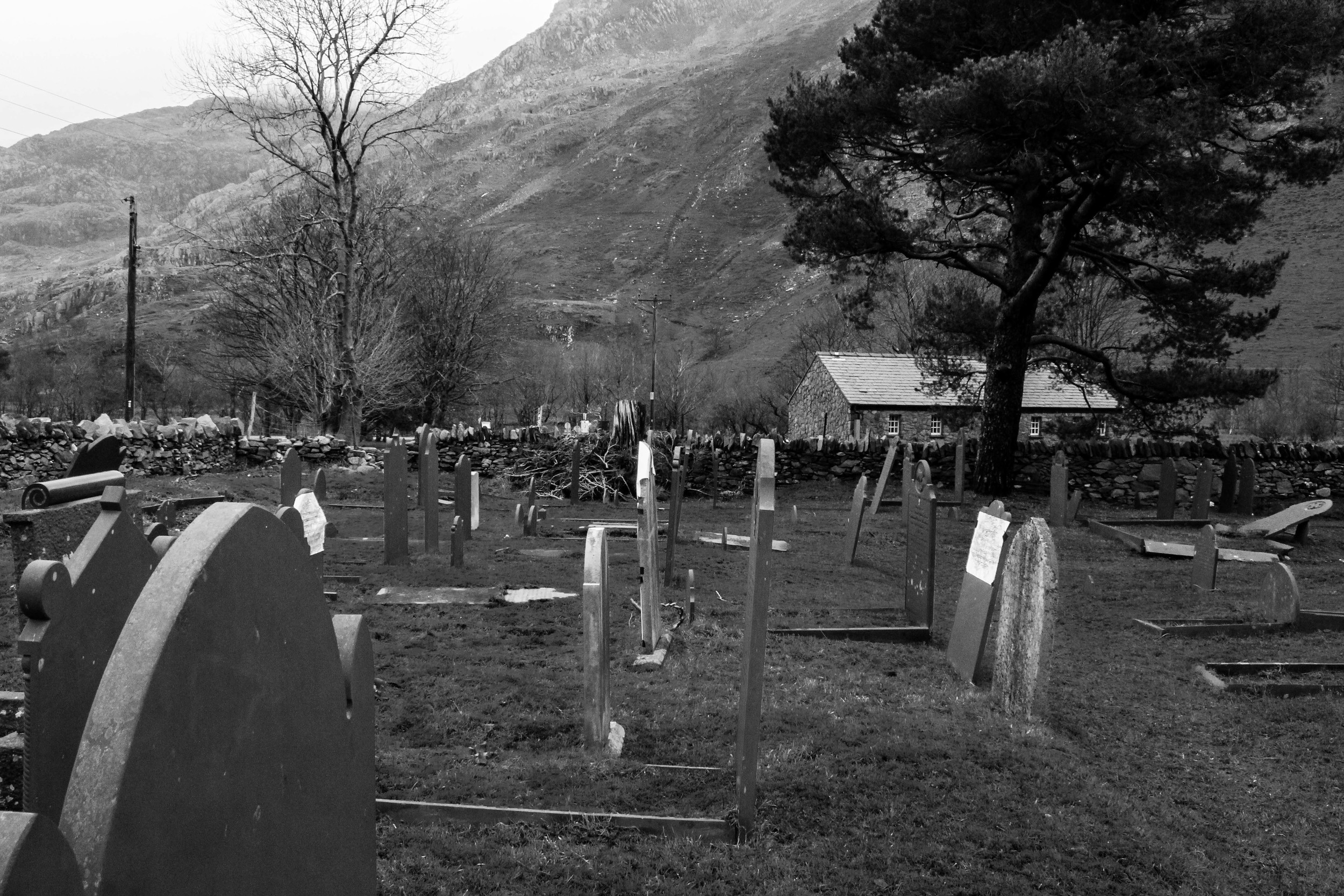 The Williams' family graves: Griffith (jr), Owen, Ellen and Robert. All in a line in the South East corner of Nantperis Graveyard. Facing their home, Coed Gwydr.