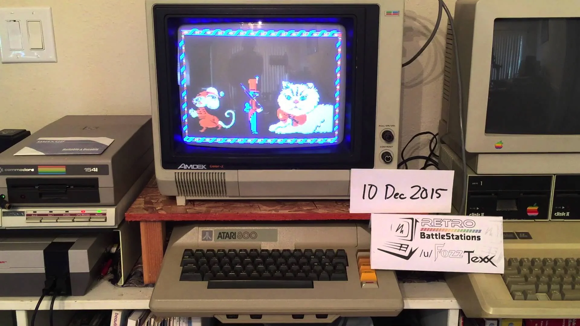 A Commodore 1541 disc drive at left, next to an Atari 800 computer, next to an Apple IIe. Probably the only time you'll ever see these things next to one another...