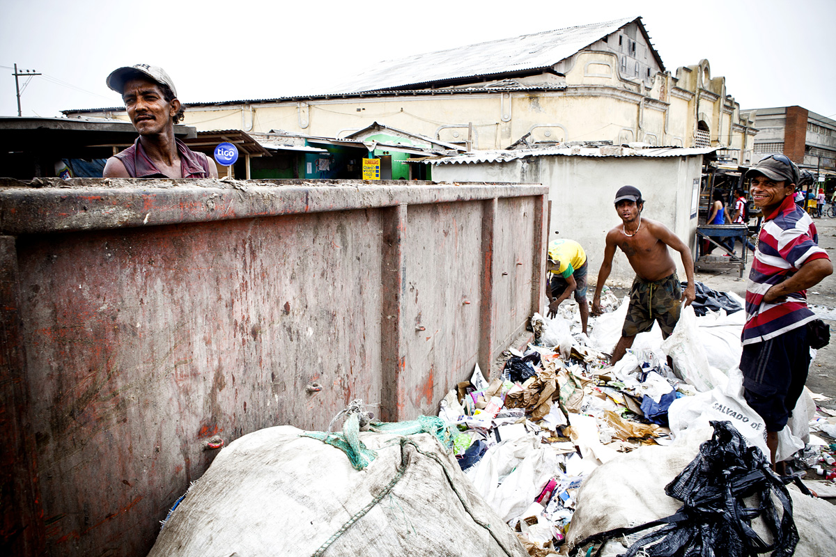Men working together to sort trash in Barranquilla, Colombia 2014.
