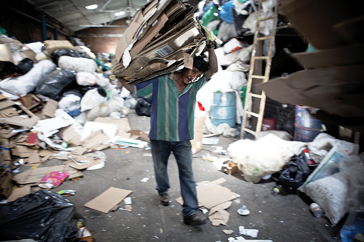 Man recycling cardboard at ARB. Bogota 2014.