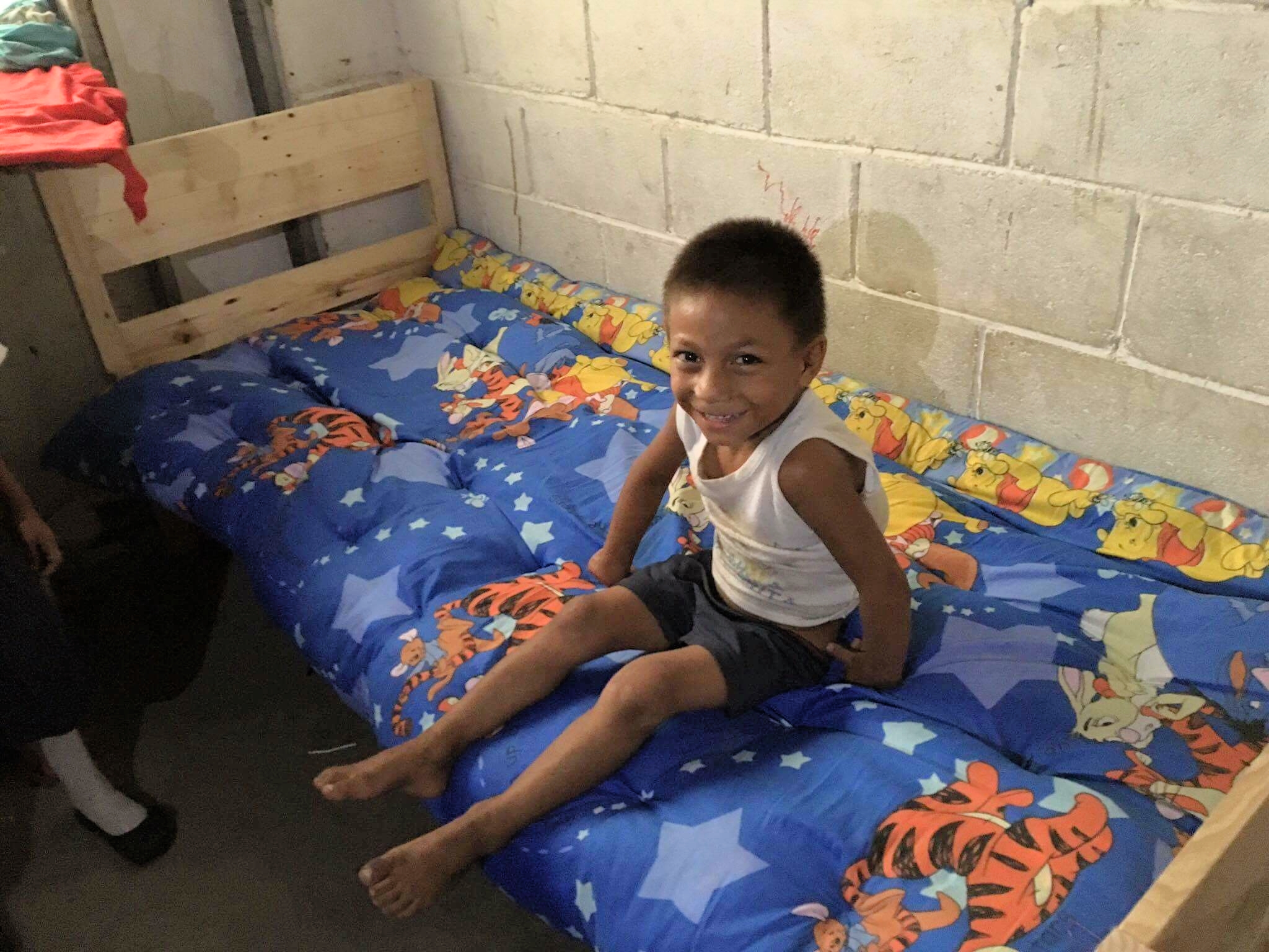 Moises excited to play on his new bed.