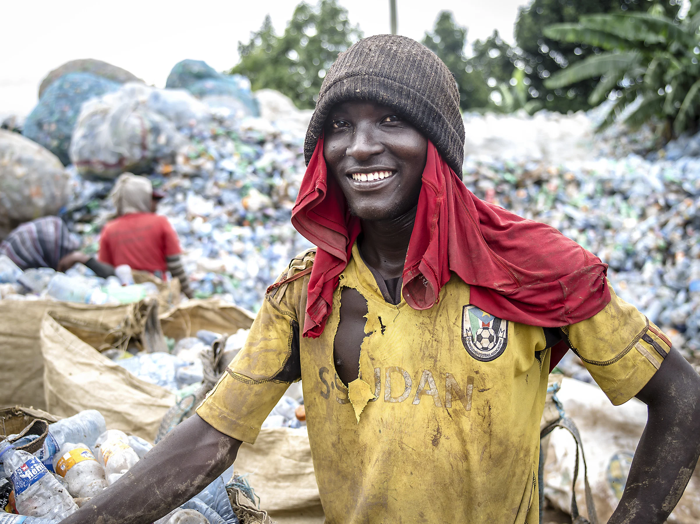 Man sorting plastics at the Kampala dumpsite. 