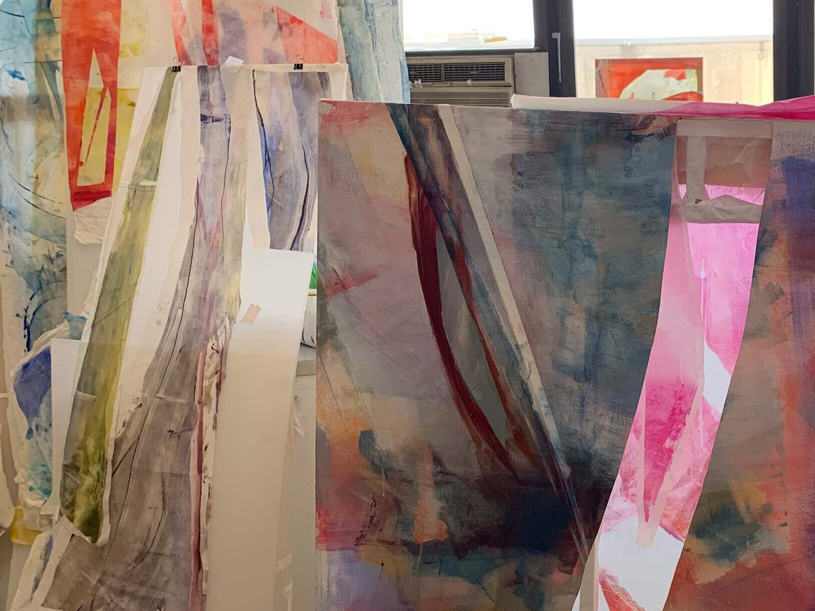  Working with natural light behind piece to compose painting with translucent prints on mulberry paper. 