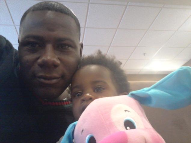 Sgt. Terry Achane of South Carolina, with his daughter Teleah, 22 months, after a court hearing in Utah 2013-01-25