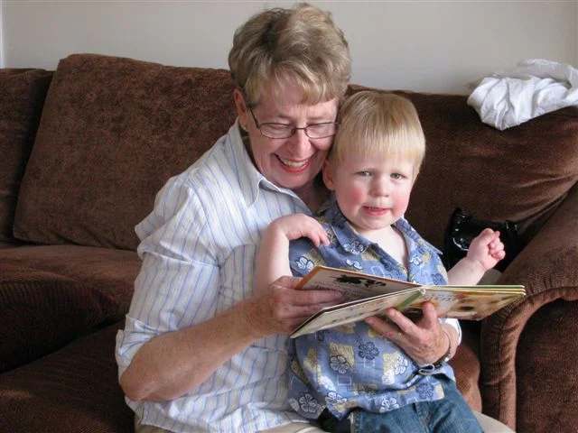 Brandon's 2nd birthday - Grandma took some time to read to him before presents.