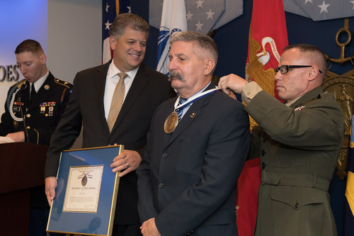 Receiving Award from Major General Daniel J. Lecce, USMC-Staff Judge Advocate to the Commandant of the Marine Corps