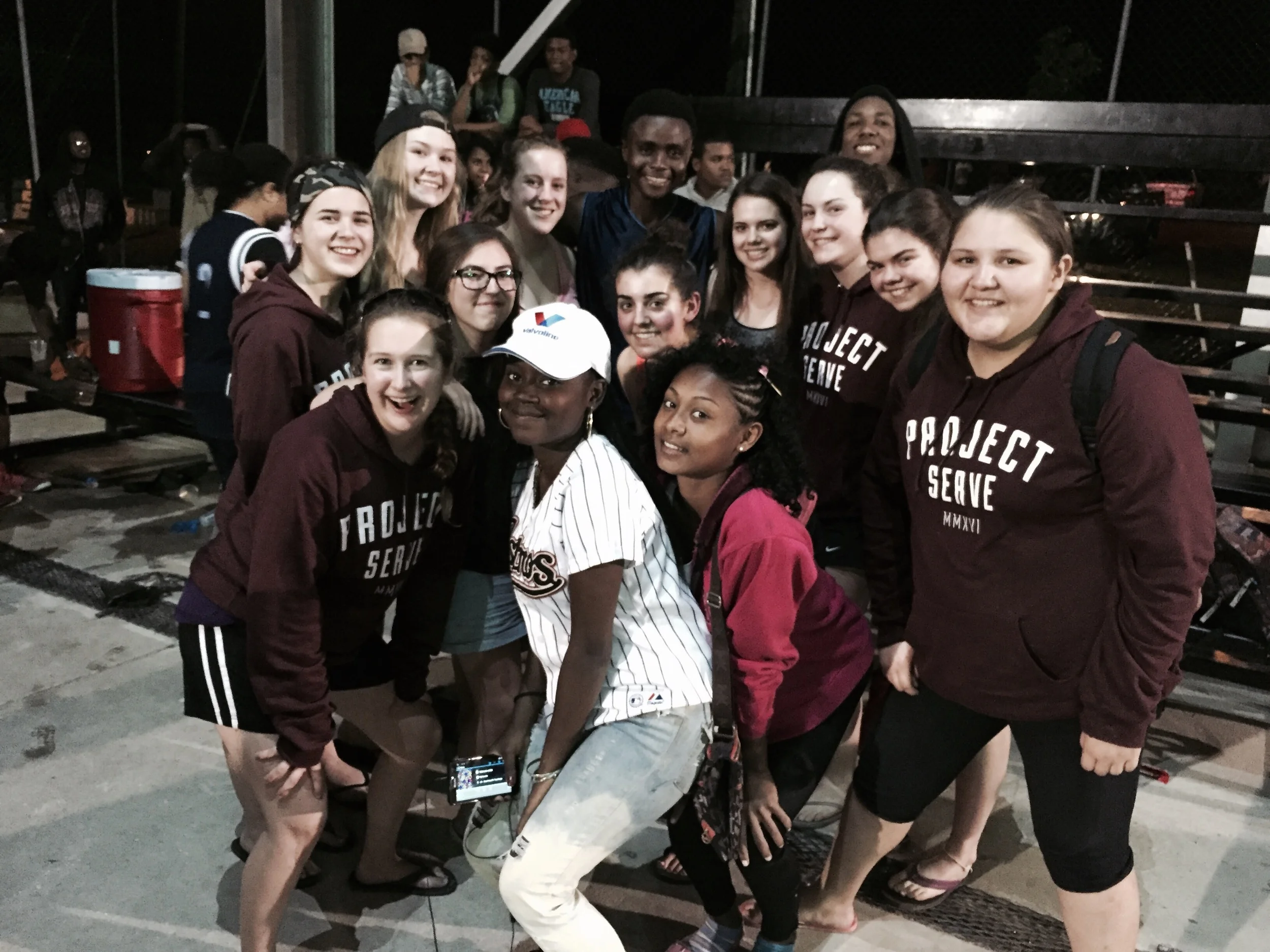 The team celebrating the victory with Lawrence and some new friends