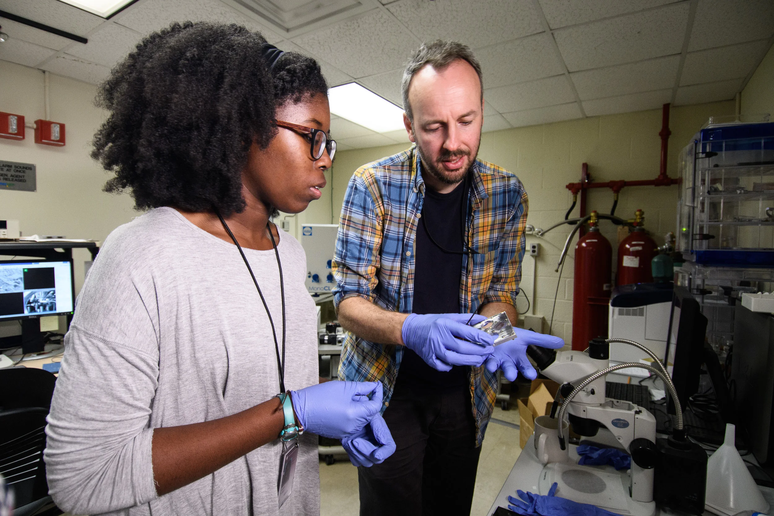Pomona College student D'Maia Curry works with an electron microscope with her mentor, Dr. Ioan Lascu, at the Smithsonian National Museum of Natural History in Washington, DC.